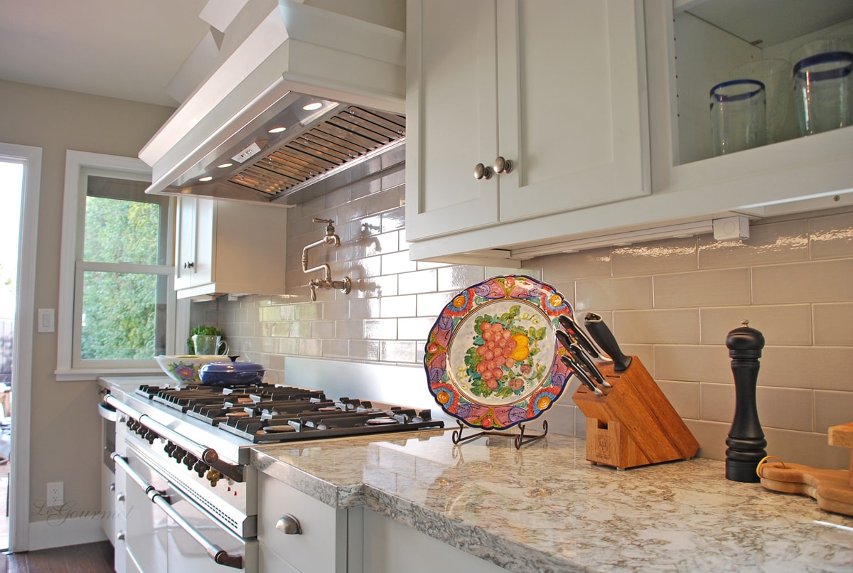 Kitchen design with custom wall-mounted hood